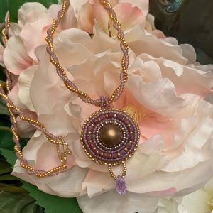 Hand beaded cabachon with beaded necklace.